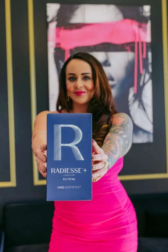 A Radiesse+ carton held to camera