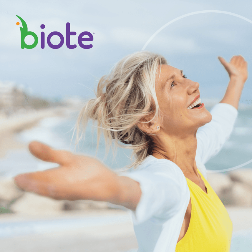 A Biote card: a woman on a beach with her arms outstretched
